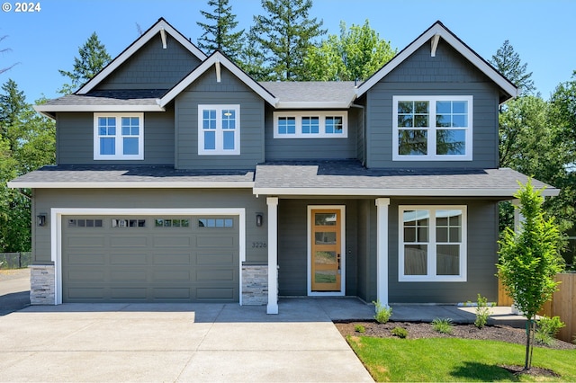 craftsman house with a garage