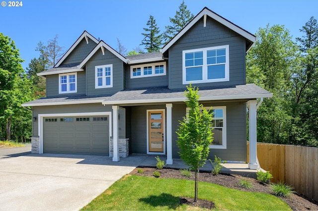 craftsman-style home featuring a garage and covered porch