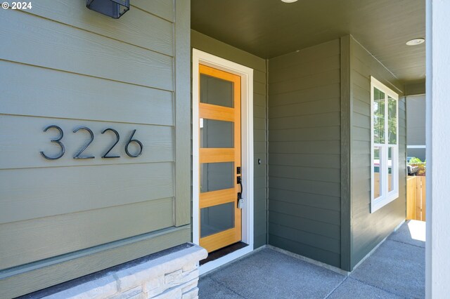 hallway with light hardwood / wood-style floors