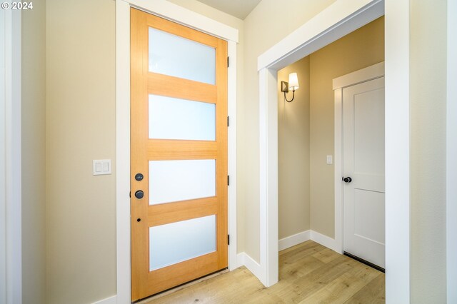 empty room with light hardwood / wood-style flooring