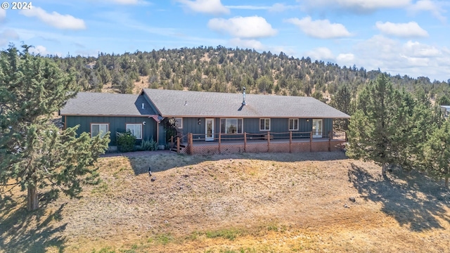 6997 SE Scenic Dr, Prineville, OR 97754 - view of front of home featuring a view of trees and a deck
