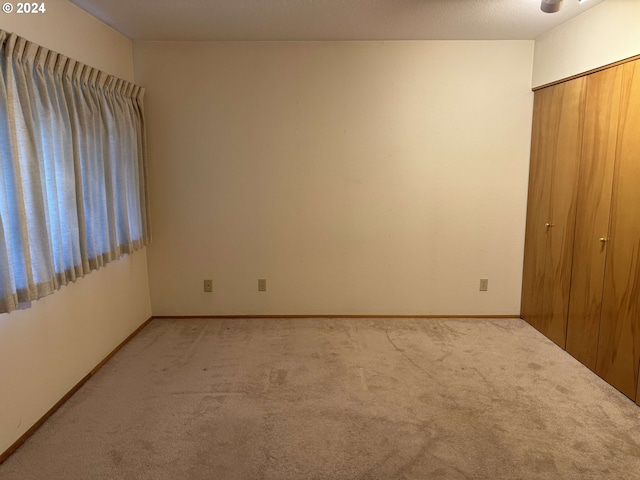 unfurnished bedroom featuring carpet