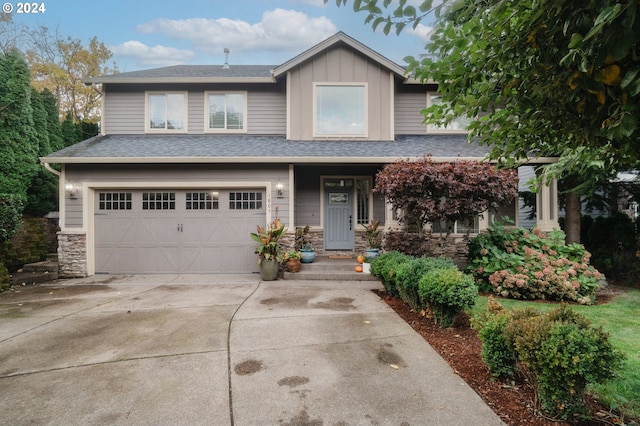 1805 NE 72nd Cir, Vancouver, WA 98665 - view of front of home featuring an attached garage, driveway, board and batten siding, a shingled roof, and stone siding