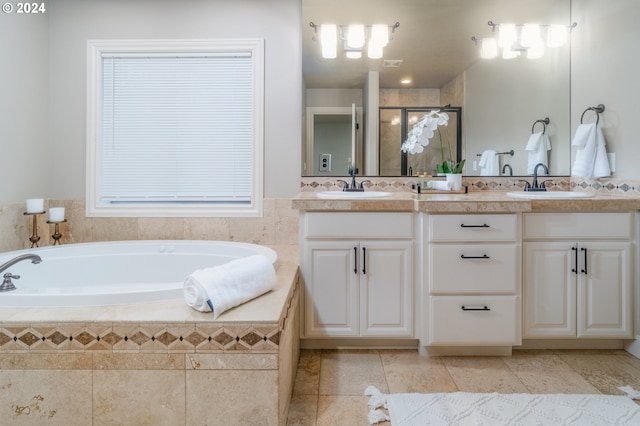 bathroom featuring vanity and separate shower and tub