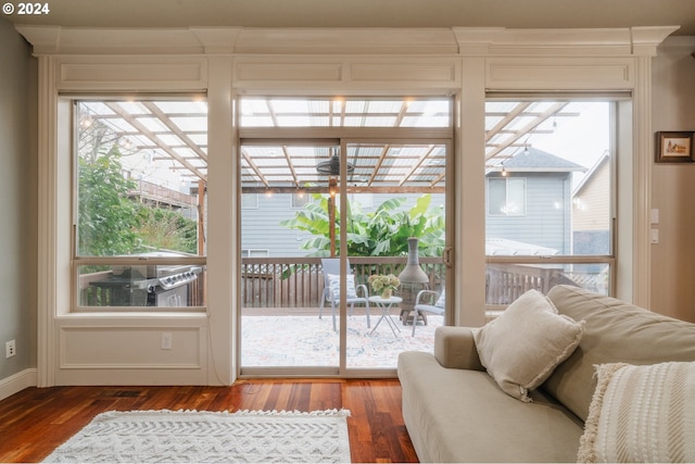 entryway featuring a healthy amount of sunlight and dark hardwood / wood-style floors