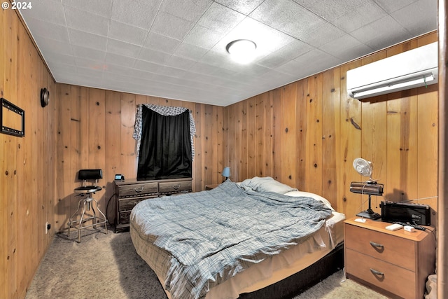 bedroom featuring carpet and an AC wall unit