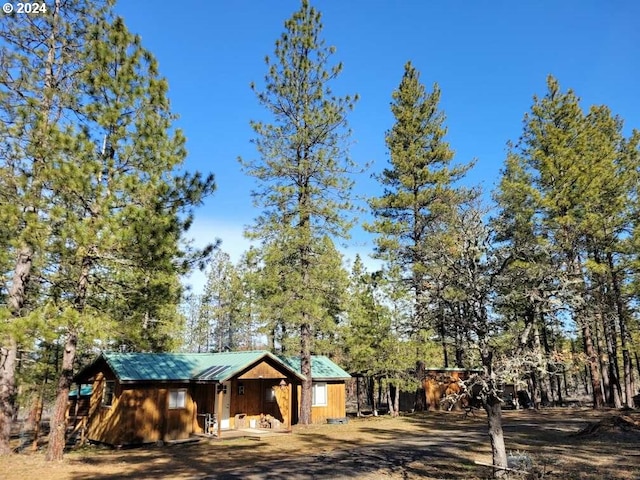 view of front of house with an outdoor structure