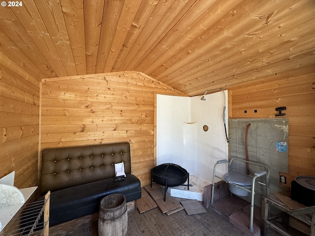 interior space with wood walls, wood ceiling, and wood-type flooring