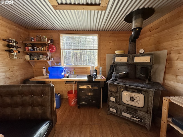 interior space featuring wood walls, dark wood-type flooring, and wood ceiling