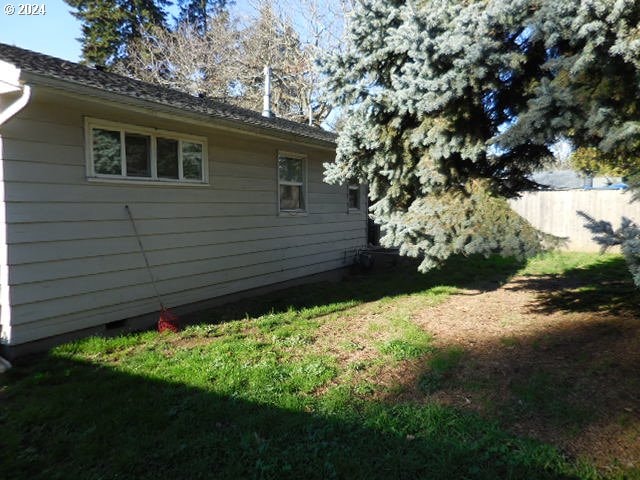 view of property exterior featuring a yard