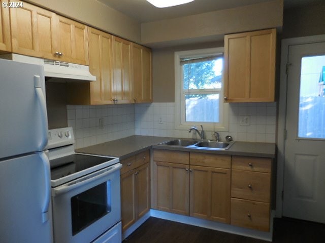 kitchen featuring decorative backsplash, white appliances, sink, and light brown cabinets