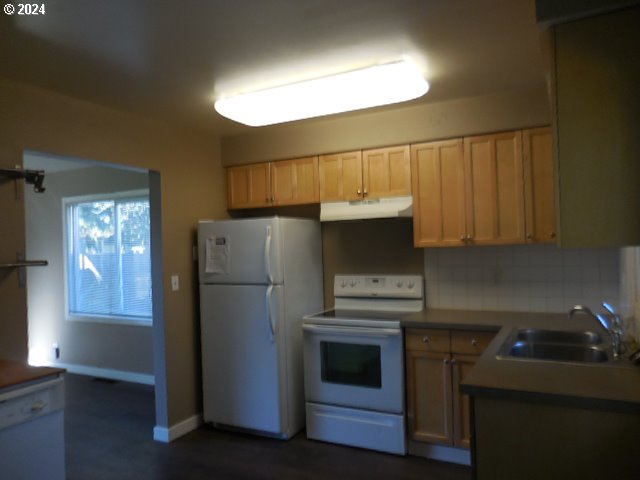 4954 SE 108th Ave, Portland, OR 97266 - kitchen with white appliances, under cabinet range hood, and backsplash