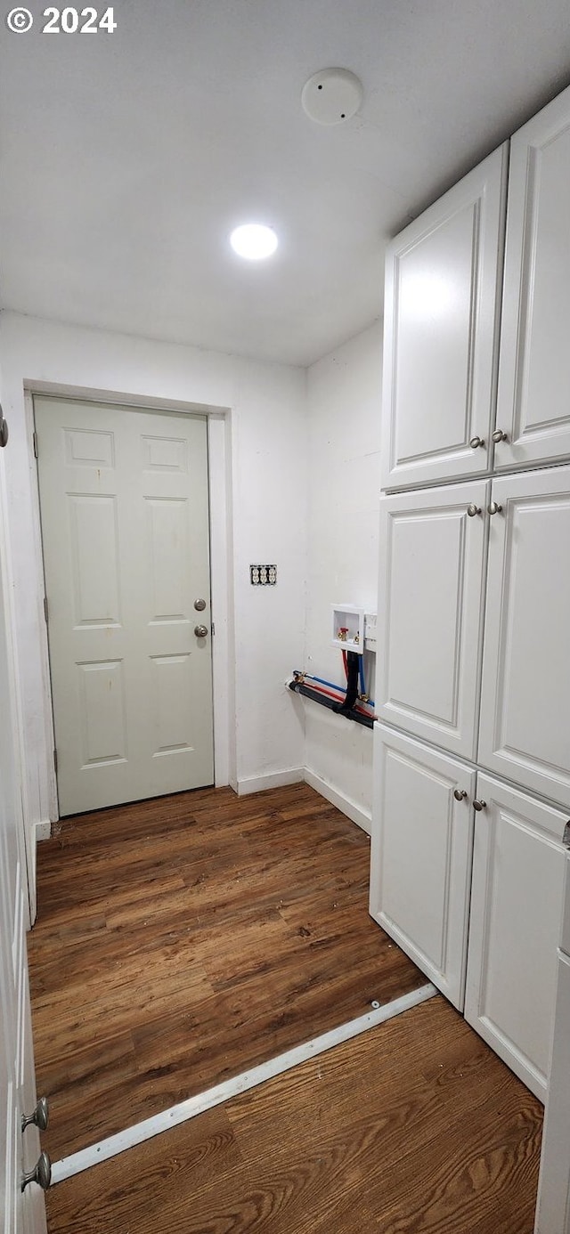 corridor featuring dark hardwood / wood-style floors