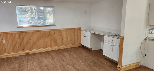 kitchen featuring dark hardwood / wood-style flooring and white cabinetry