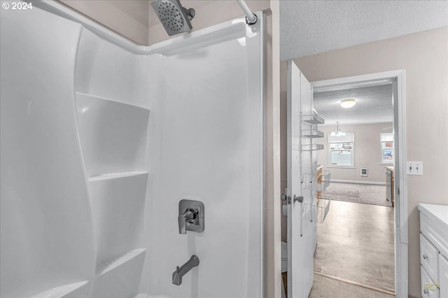 bathroom featuring vanity and a textured ceiling