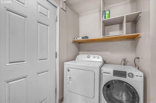 washroom featuring washer and dryer