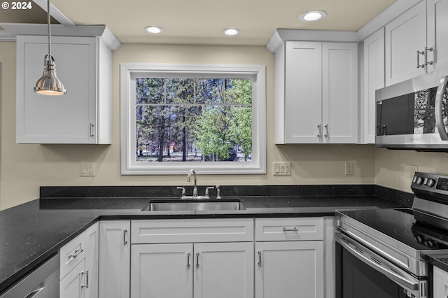 52582 Doe Ln, La Pine, OR 97739 - kitchen featuring a sink, appliances with stainless steel finishes, white cabinets, and recessed lighting