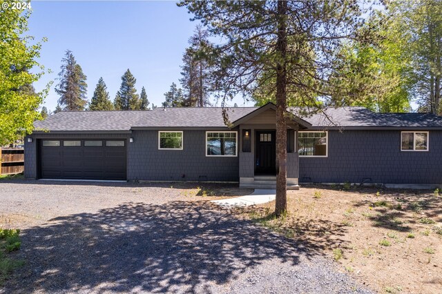 52582 Doe Ln, La Pine, OR 97739 - single story home with a garage, driveway, and roof with shingles