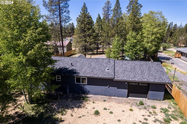 52582 Doe Ln, La Pine, OR 97739 - exterior space featuring fence, roof with shingles, and a garage