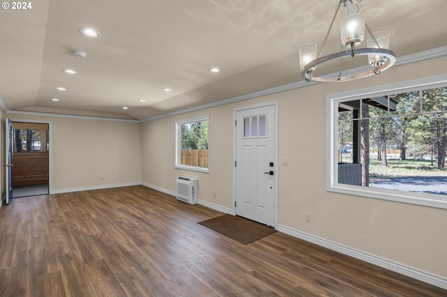 52582 Doe Ln, La Pine, OR 97739 - foyer featuring crown molding, baseboards, wood finished floors, and a notable chandelier