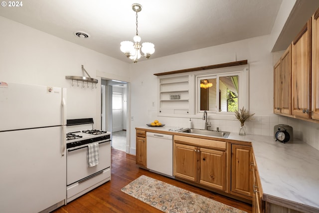 kitchen featuring pendant lighting, white appliances, sink, tasteful backsplash, and dark hardwood / wood-style flooring