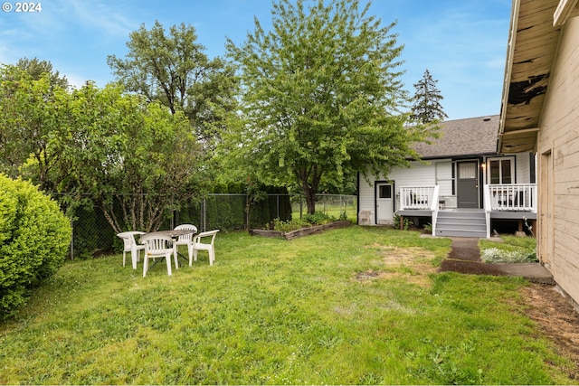 view of yard featuring a wooden deck