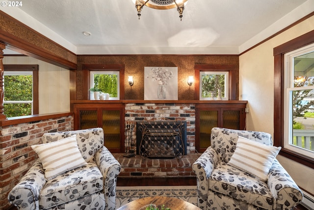 living area featuring a fireplace, hardwood / wood-style floors, and plenty of natural light