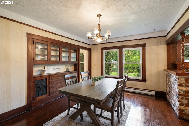 dining space with baseboard heating, dark wood-type flooring, a textured ceiling, and a notable chandelier