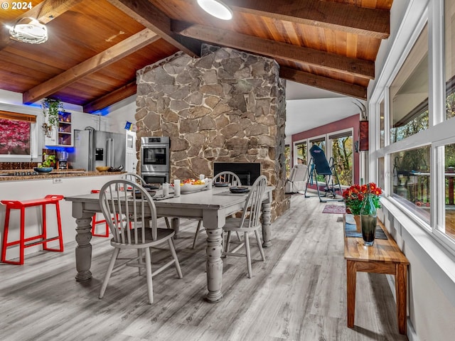 wooden terrace featuring a fireplace