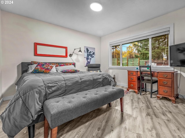 bedroom with light wood-type flooring