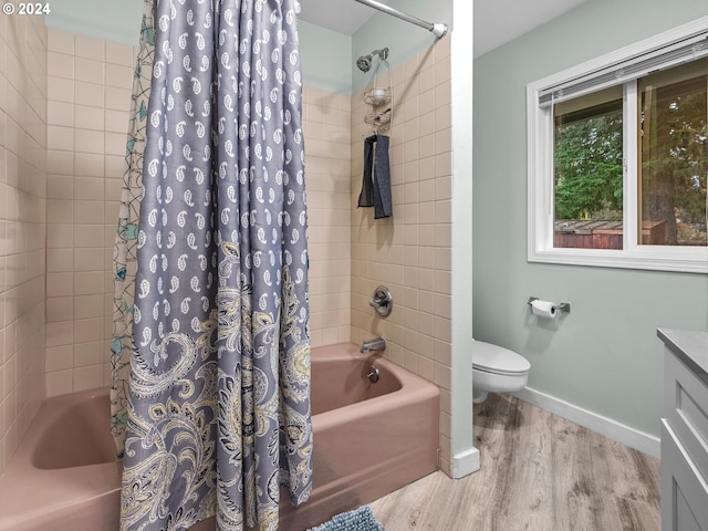 full bathroom with vanity, wood-type flooring, shower / bath combination with curtain, and toilet