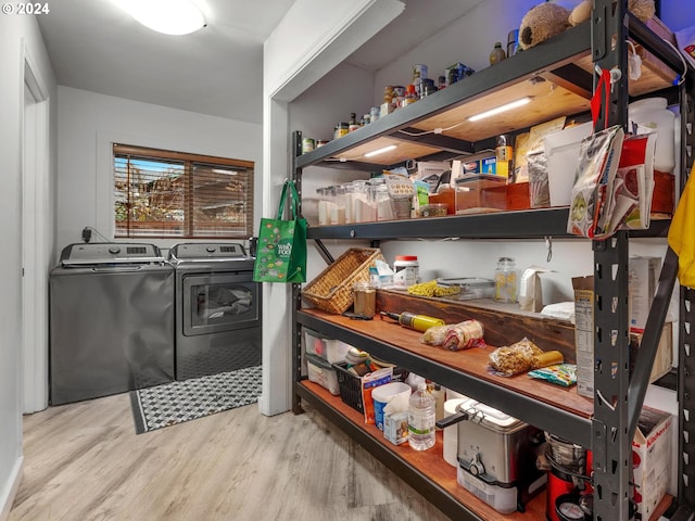 interior space featuring washer and dryer and light hardwood / wood-style floors