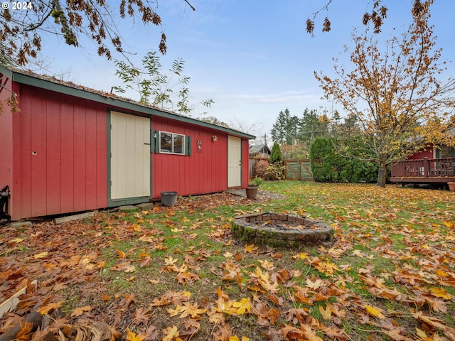 view of outdoor structure with a fire pit