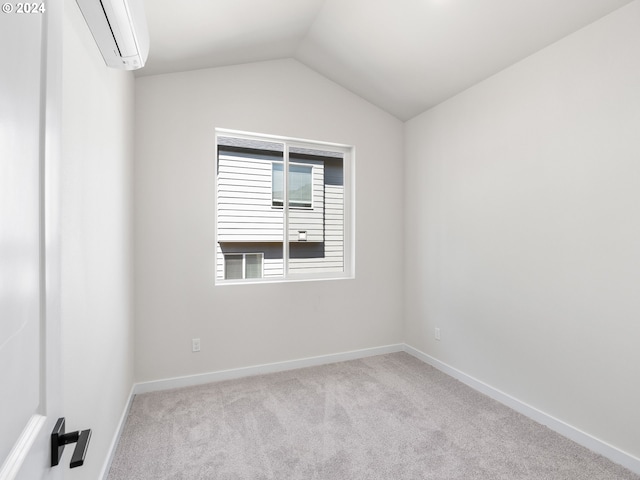 carpeted empty room featuring lofted ceiling and a wall mounted AC