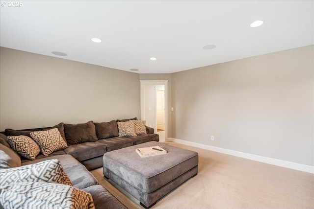 living room featuring recessed lighting, light colored carpet, and baseboards