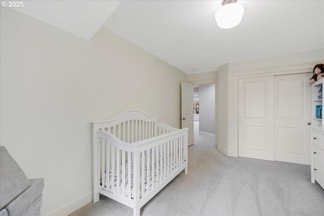 bedroom featuring carpet floors, a closet, and baseboards