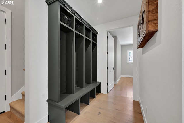 mudroom with light hardwood / wood-style flooring