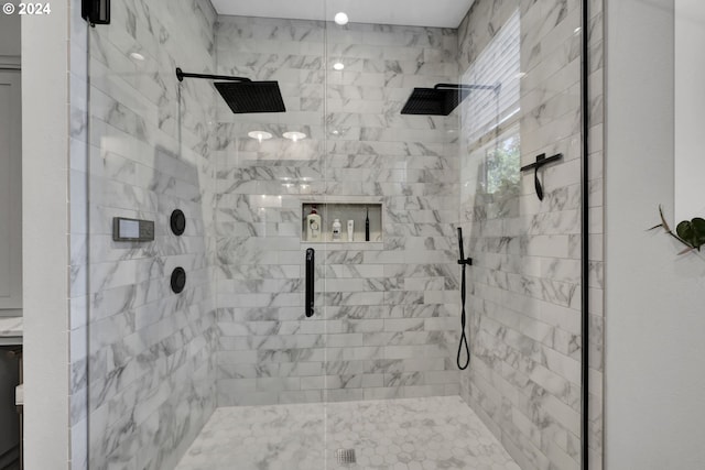 bathroom featuring a shower with door