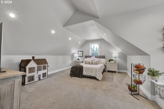 carpeted bedroom with lofted ceiling