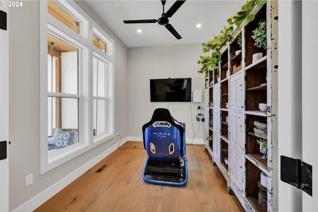 interior space with hardwood / wood-style floors and ceiling fan