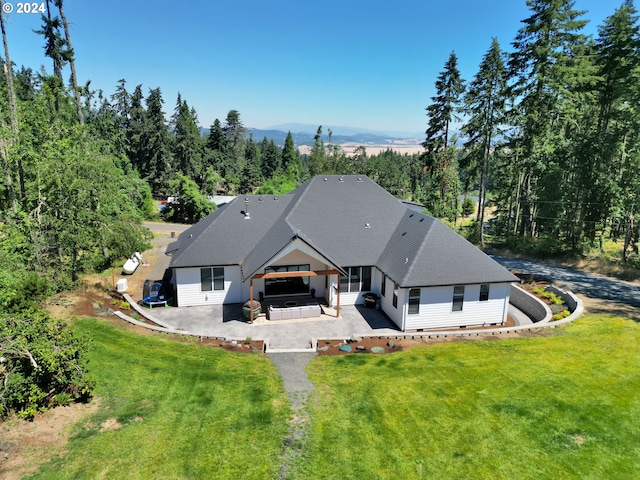 drone / aerial view featuring a mountain view