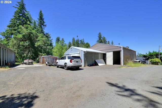 view of side of home with an outdoor structure