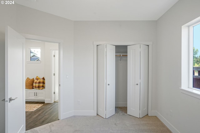 unfurnished bedroom with light colored carpet