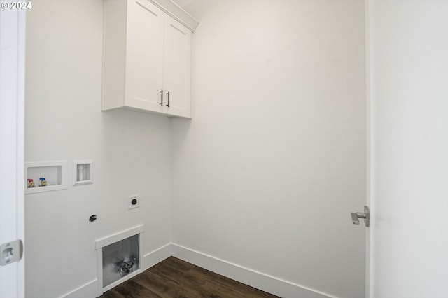 clothes washing area featuring dark wood-type flooring, washer hookup, hookup for an electric dryer, and cabinets