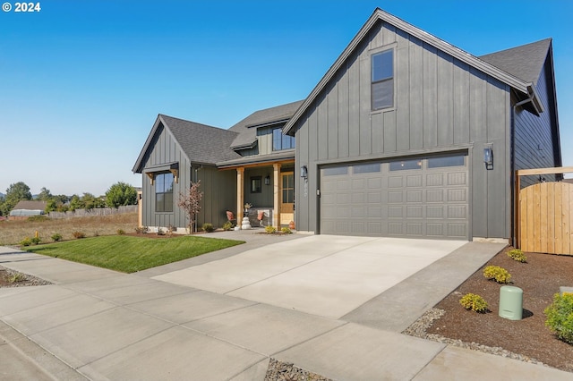 modern farmhouse style home featuring a front lawn and a garage