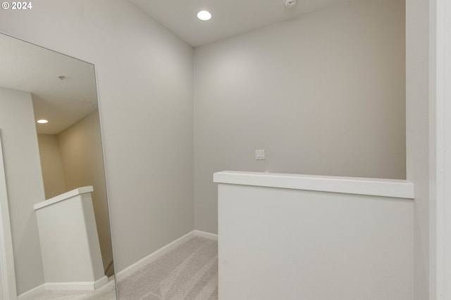 corridor featuring recessed lighting, carpet flooring, an upstairs landing, and baseboards