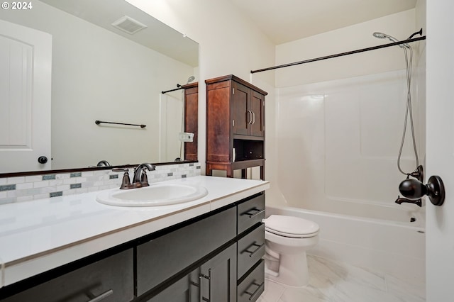 full bathroom with tasteful backsplash, bathtub / shower combination, vanity, and toilet