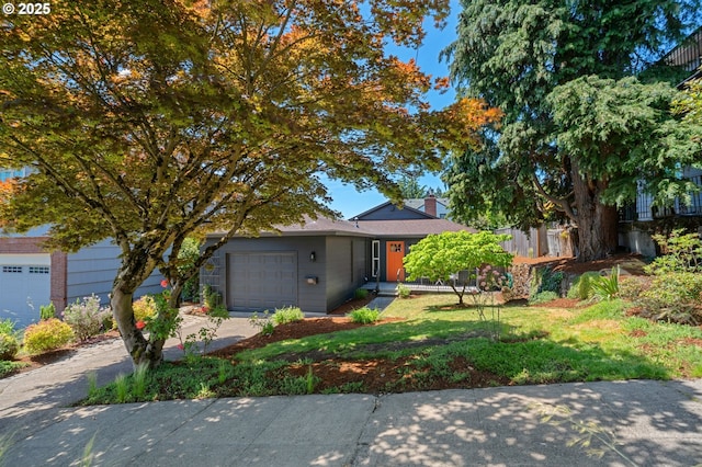 3427 NE 32nd Pl, Portland, OR 97212 - view of front of property featuring an attached garage, concrete driveway, a chimney, and a front yard