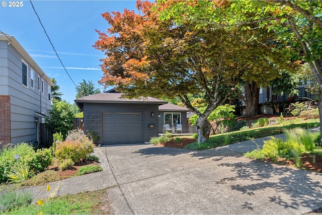 3427 NE 32nd Pl, Portland, OR 97212 - view of front of property featuring a garage and concrete driveway