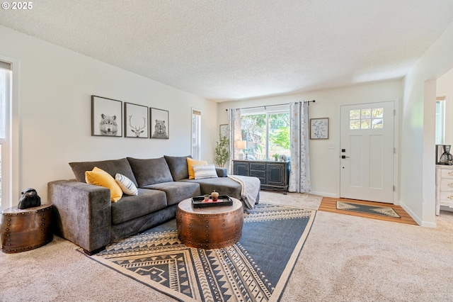 3427 NE 32nd Pl, Portland, OR 97212 - carpeted living area featuring a textured ceiling and baseboards